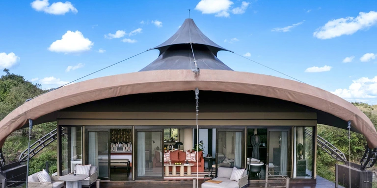 Lodge interior tented suite with premium furnishings
